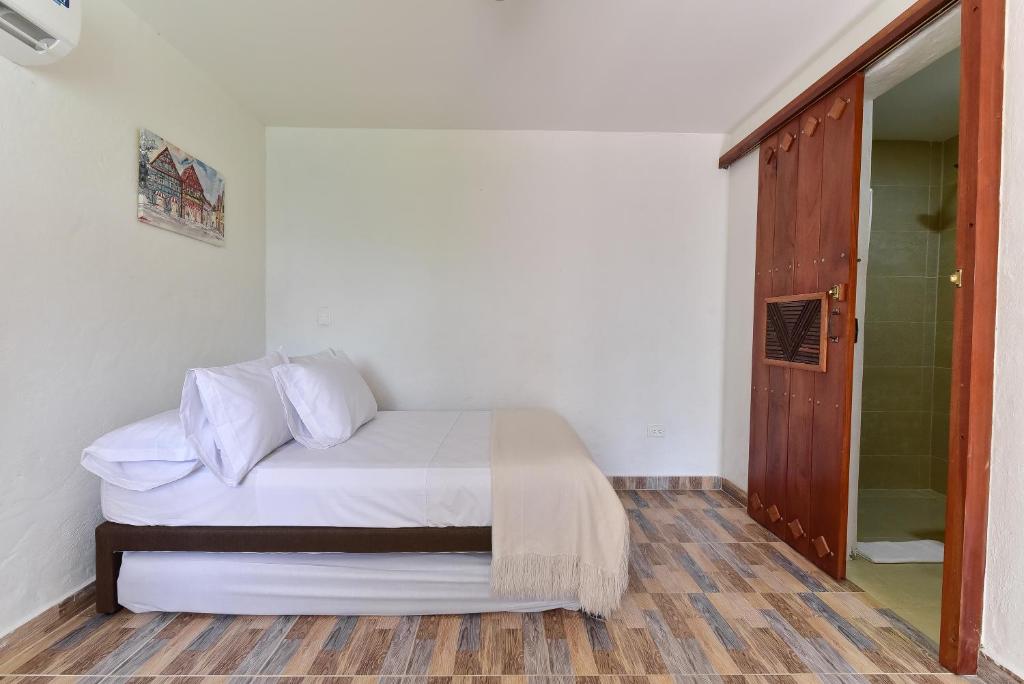 Postel nebo postele na pokoji v ubytování CABAÑAS LA DORADA