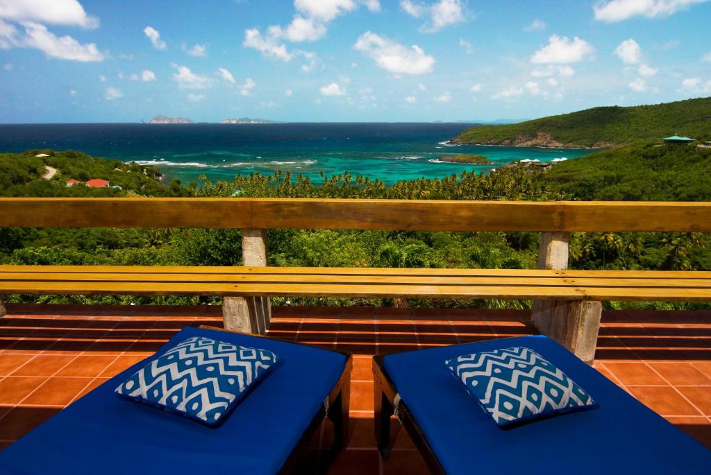 a balcony with a view of the ocean at Sugar Reef Bequia - Adults Only in Crescent Beach