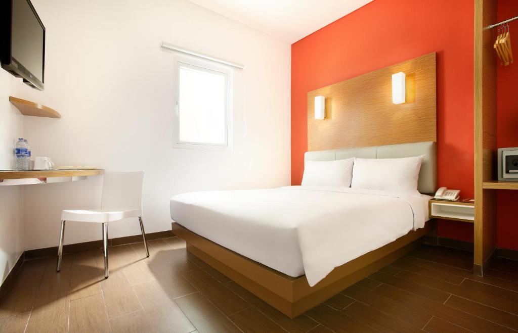 Postel nebo postele na pokoji v ubytování Amaris Hotel Season City