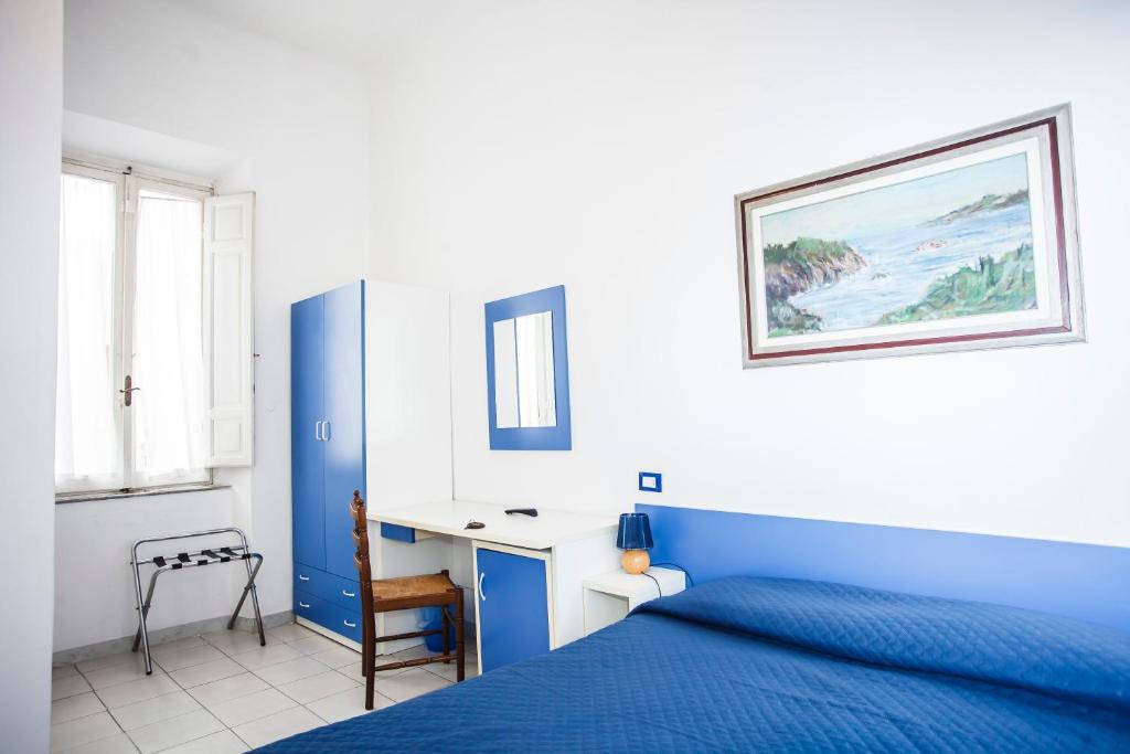Postel nebo postele na pokoji v ubytování Hotel Rex