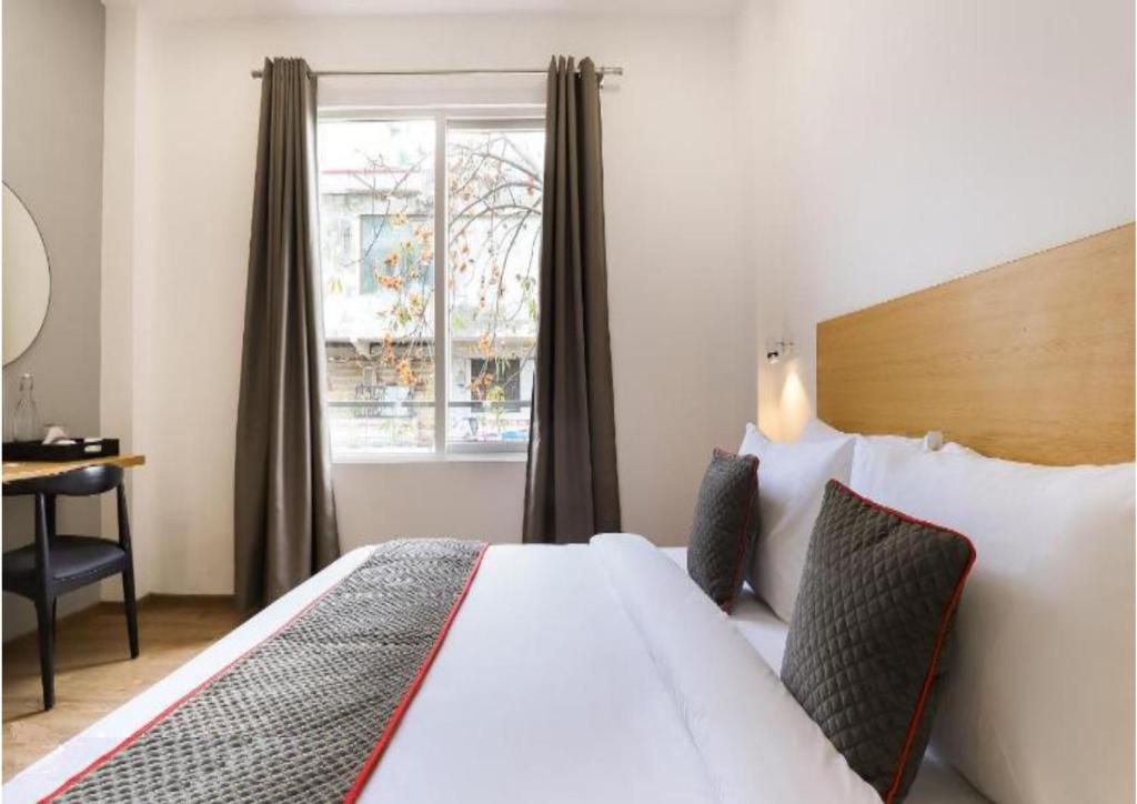 Un pat sau paturi într-o cameră la Hotel Kingston House