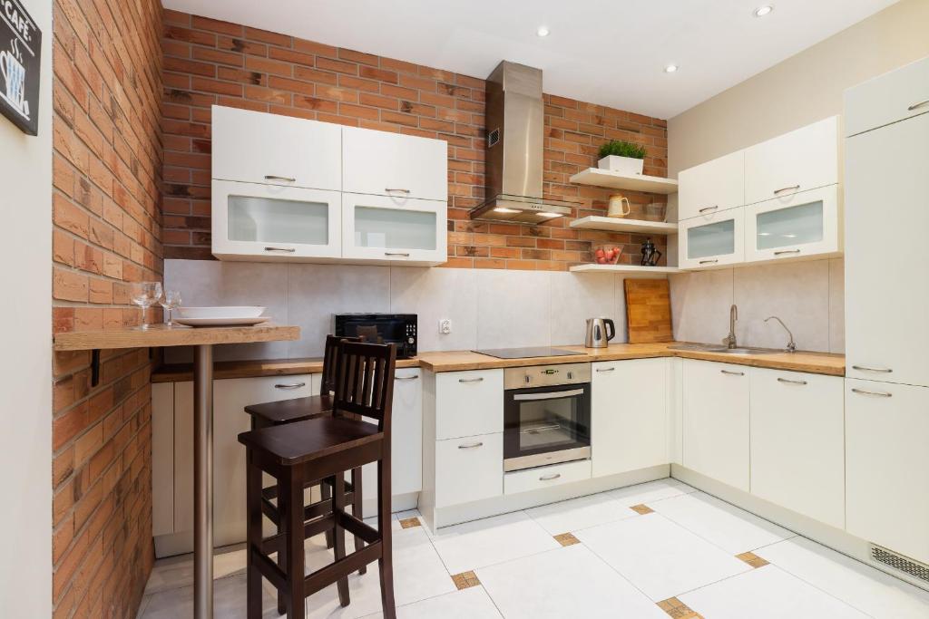 Kuchyňa alebo kuchynka v ubytovaní Deluxe Apartments Kraków Brzozowa by Noclegi Renters