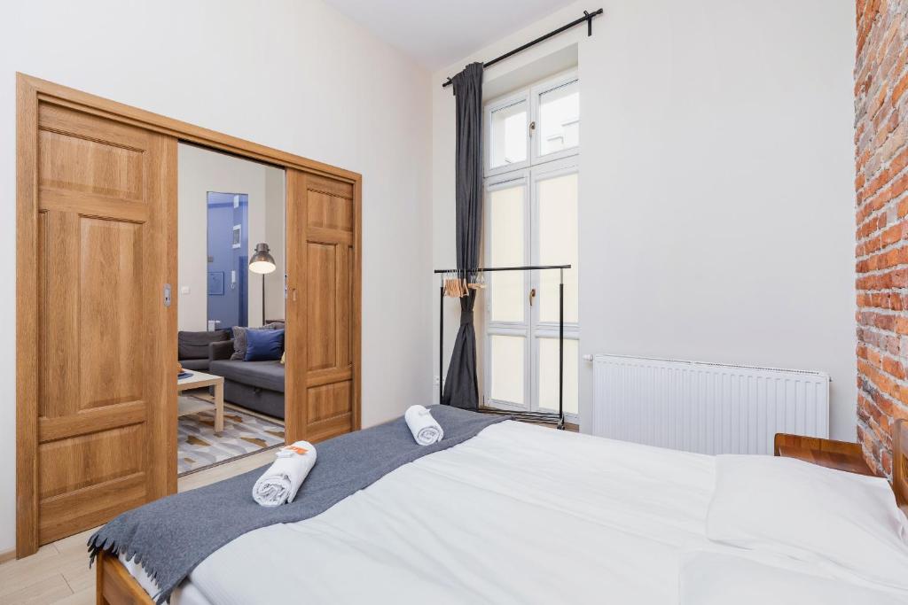 Posteľ alebo postele v izbe v ubytovaní Deluxe Apartments Kraków Brzozowa by Noclegi Renters