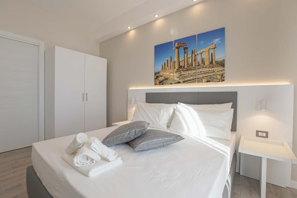 Postel nebo postele na pokoji v ubytování Esseneto Rooms