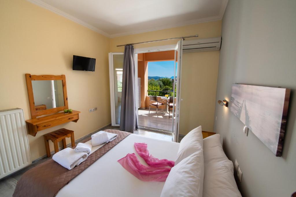 Postel nebo postele na pokoji v ubytování Artemis Pension