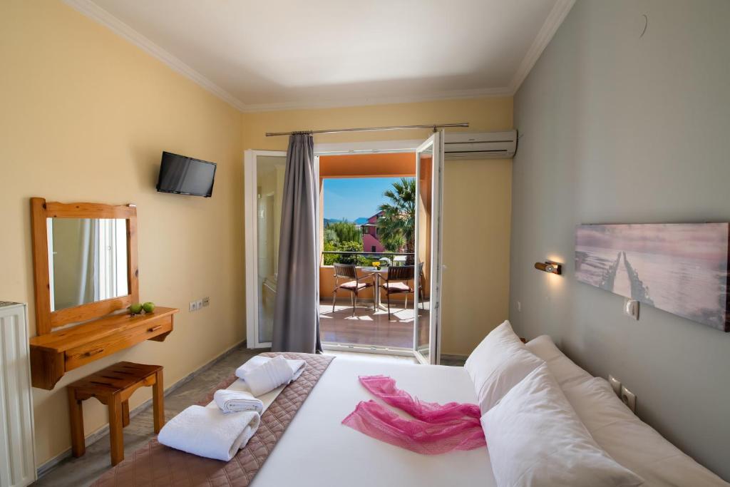 Postel nebo postele na pokoji v ubytování Artemis Pension