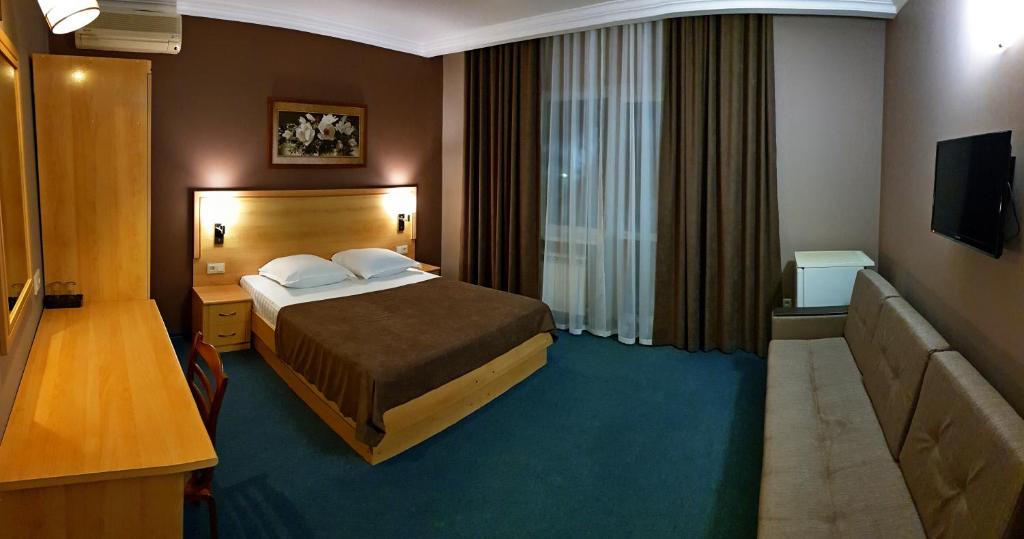 Cama o camas de una habitación en Guest House Sosnovaya Dacha
