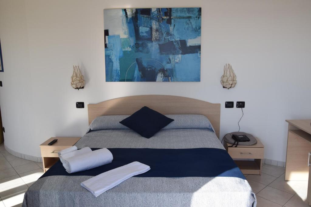 Postel nebo postele na pokoji v ubytování Hotel Profumo Di Mare