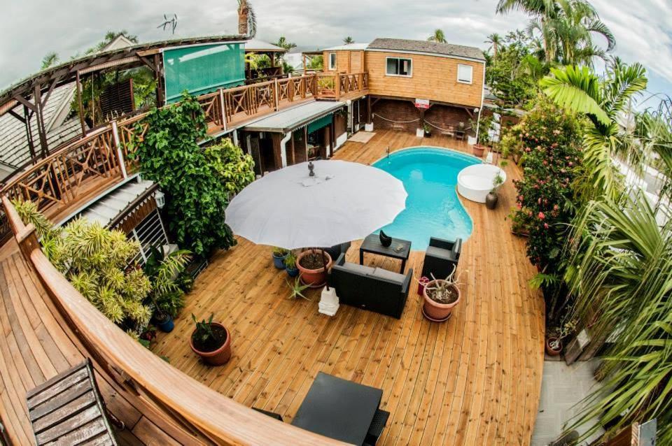 an overhead view of a deck with a swimming pool at SAS L' Ilot Vert in La Saline les Bains