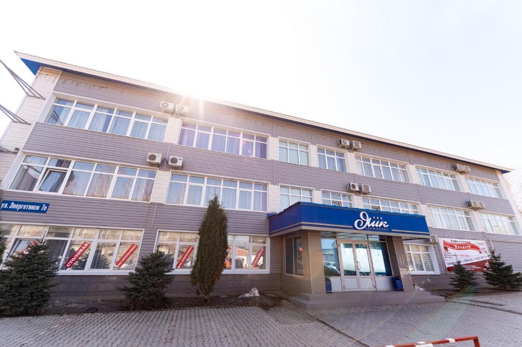 a building with a store in front of it at Hotel Yaik in Orenburg
