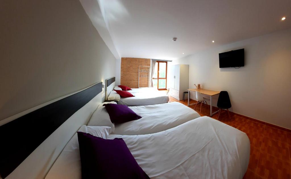 Postel nebo postele na pokoji v ubytování B&B La Atalaya