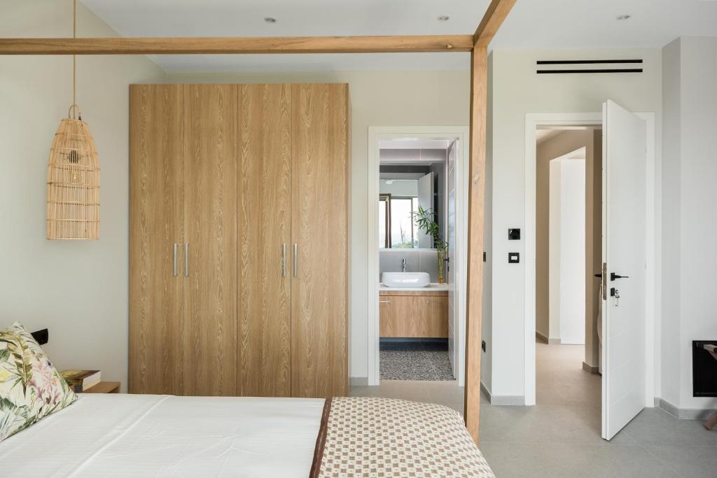 Postel nebo postele na pokoji v ubytování paleo villas