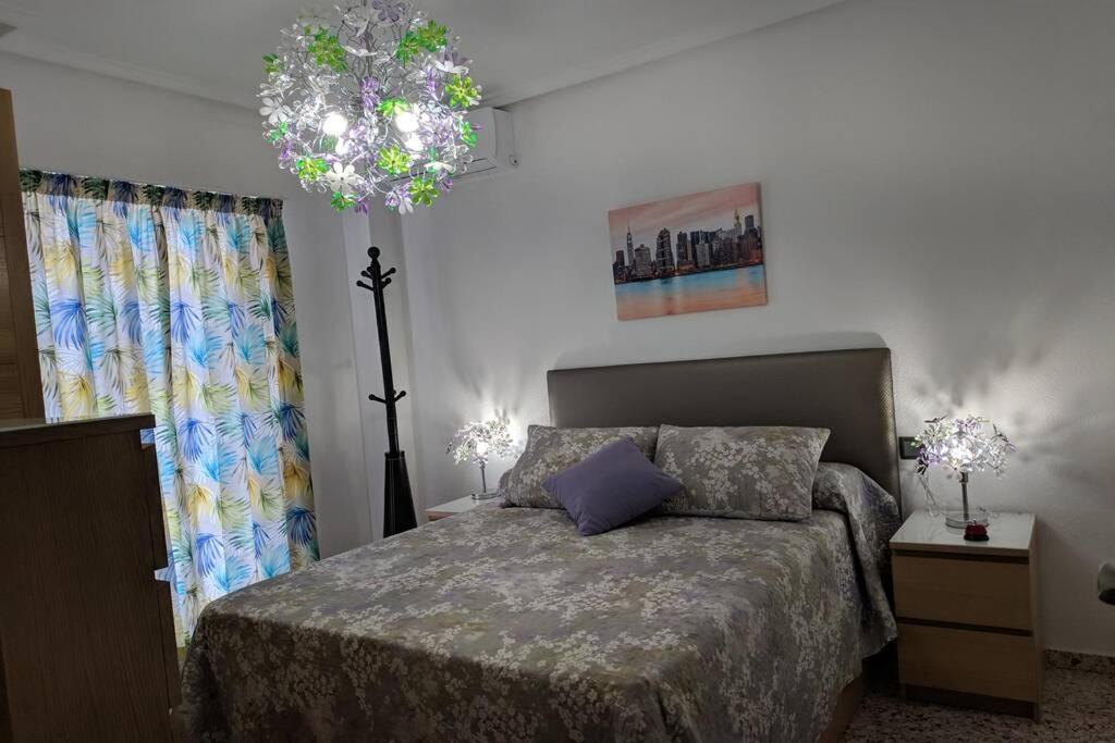 En eller flere senge i et værelse på Apartamento H9 Gran Playa con vistas al mar