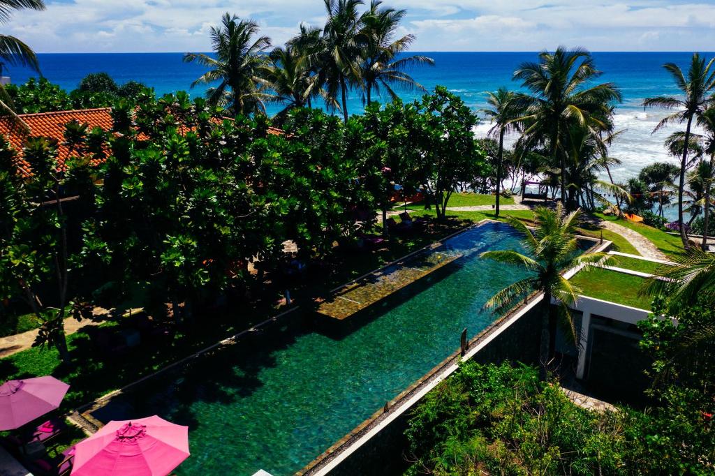 Vista de la piscina de UTMT - Underneath The Mango Tree Spa & Beach Resort o alrededores