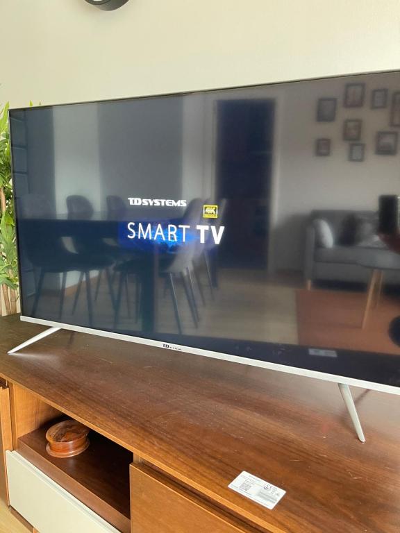 a large flat screen tv sitting on top of a table at SeaHomes Vacations, FENALS BEACH&CHIC, pk, top apartment full equipped in Lloret de Mar