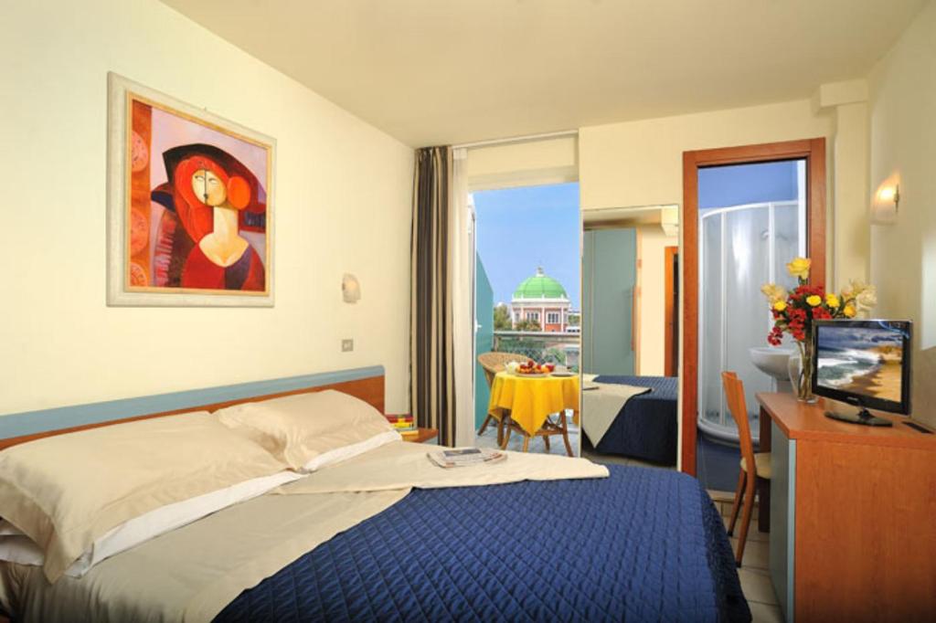 Postel nebo postele na pokoji v ubytování Hotel Astra