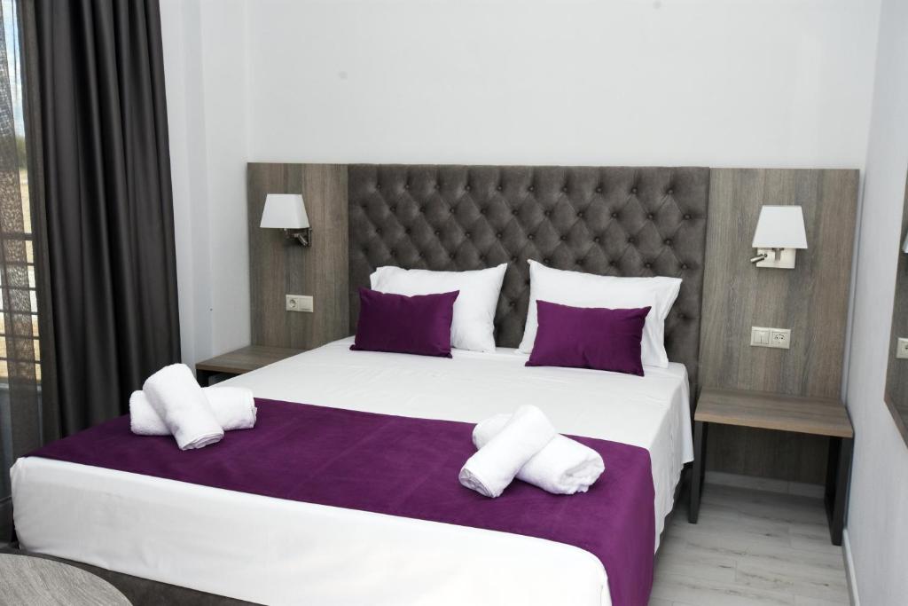 Кровать или кровати в номере GERANI apartments