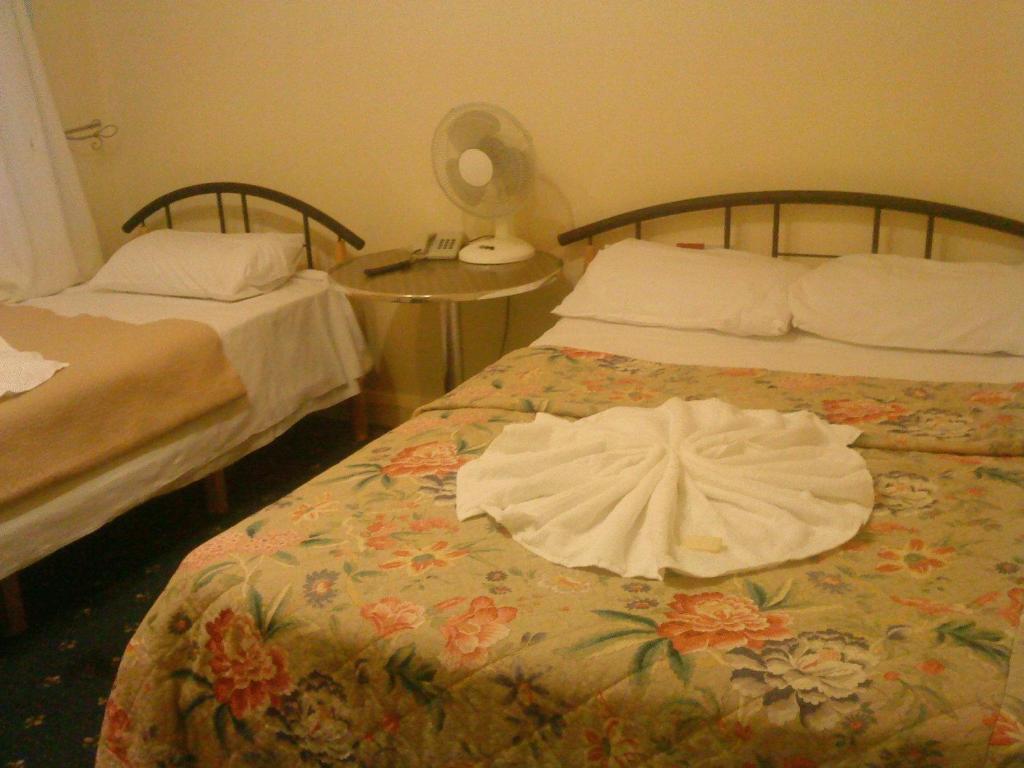 Postel nebo postele na pokoji v ubytování Hotel Sophia