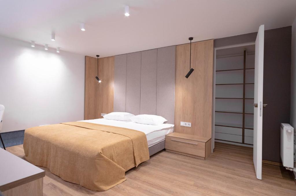 Säng eller sängar i ett rum på Duke Apartments