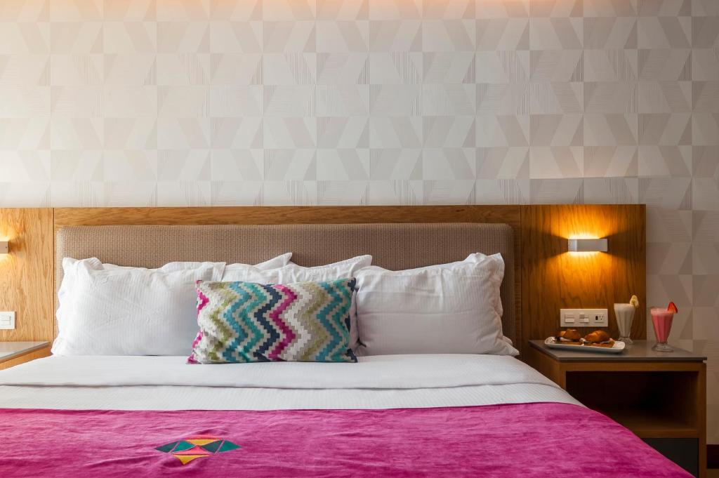 Postel nebo postele na pokoji v ubytování FCH Hotel Providencia