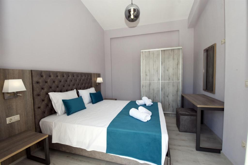 Кровать или кровати в номере GERANI apartments