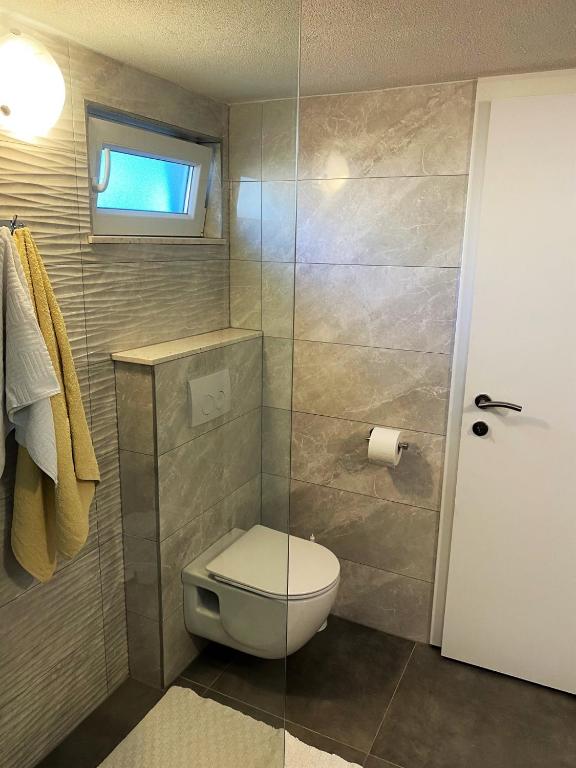 Koupelna v ubytování Holiday Home ZLATNI RAT (3543)