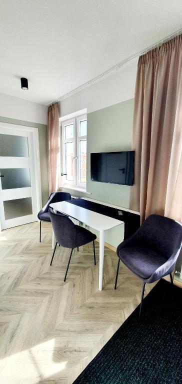 Posedenie v ubytovaní Apartamenty w Kamienicy - centrum, bezpłatny parking