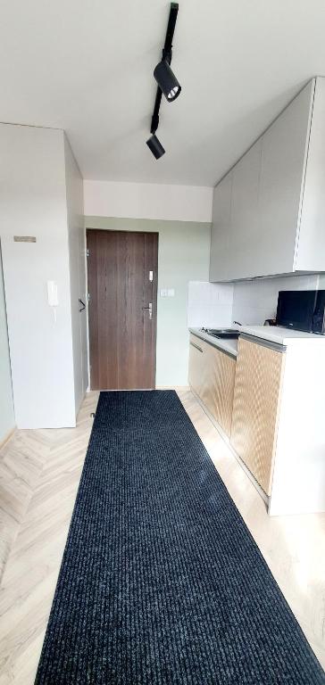 Posteľ alebo postele v izbe v ubytovaní Apartamenty w Kamienicy - centrum, bezpłatny parking