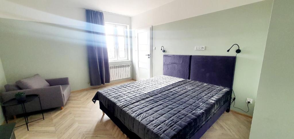 Posteľ alebo postele v izbe v ubytovaní Apartamenty w Kamienicy - centrum, bezpłatny parking