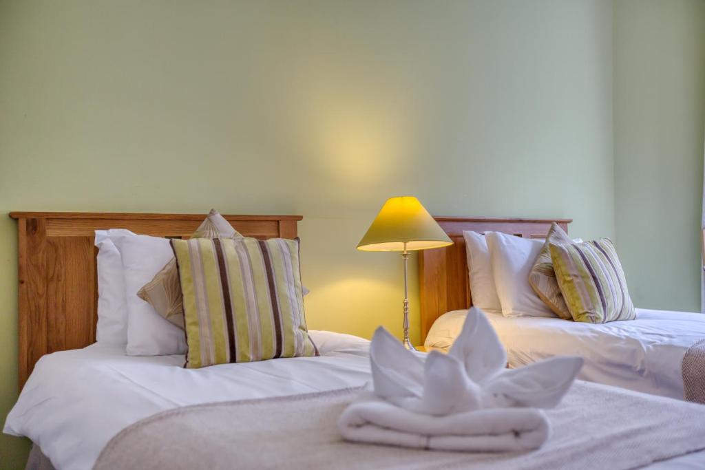 Postel nebo postele na pokoji v ubytování No32 Hotel