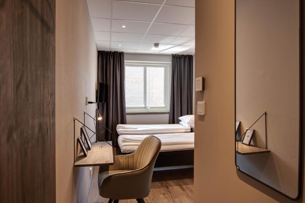 Postel nebo postele na pokoji v ubytování Karlskrona H&H