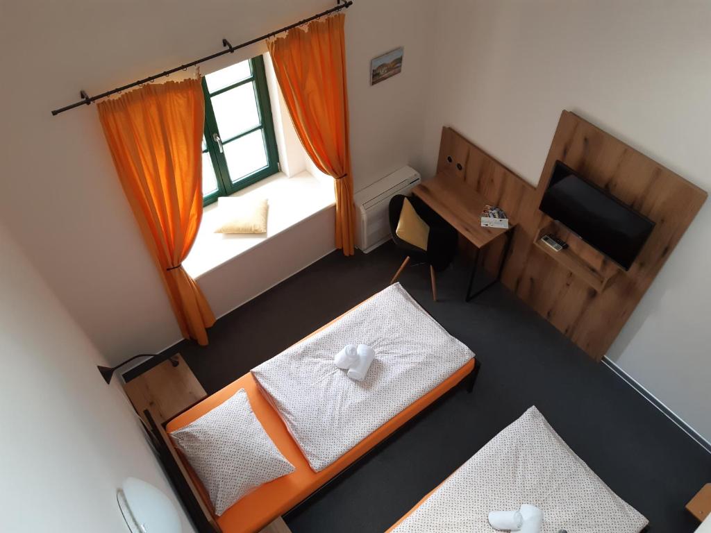 Postel nebo postele na pokoji v ubytování Wellness hotel Lihovar