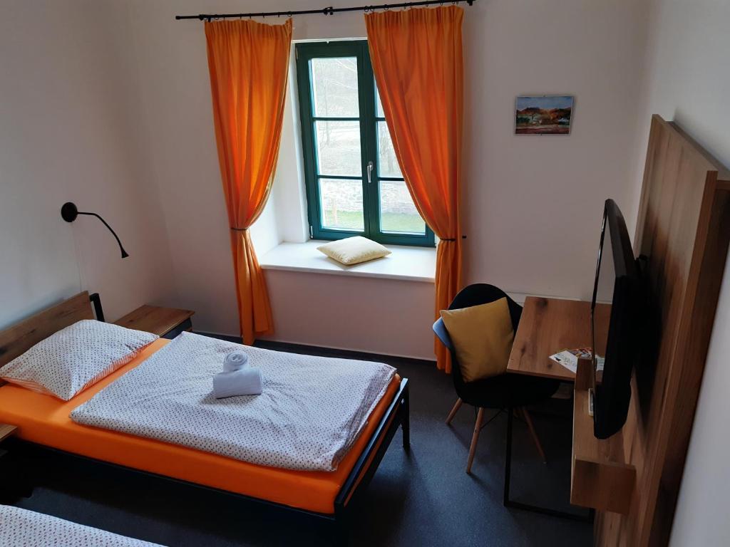 Postel nebo postele na pokoji v ubytování Wellness hotel Lihovar