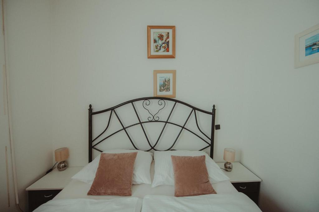 Posteľ alebo postele v izbe v ubytovaní B&B Laguna