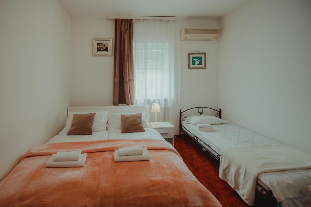 Posteľ alebo postele v izbe v ubytovaní B&B Laguna