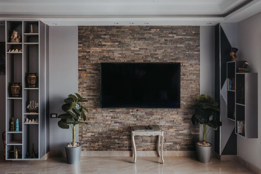 TV a/nebo společenská místnost v ubytování Pyramids Planet Hotel