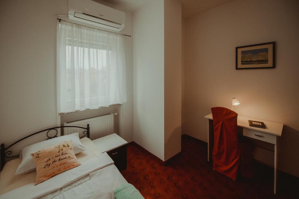 Posteľ alebo postele v izbe v ubytovaní B&B Laguna