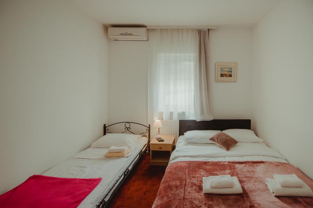 Posteľ alebo postele v izbe v ubytovaní B&B Laguna