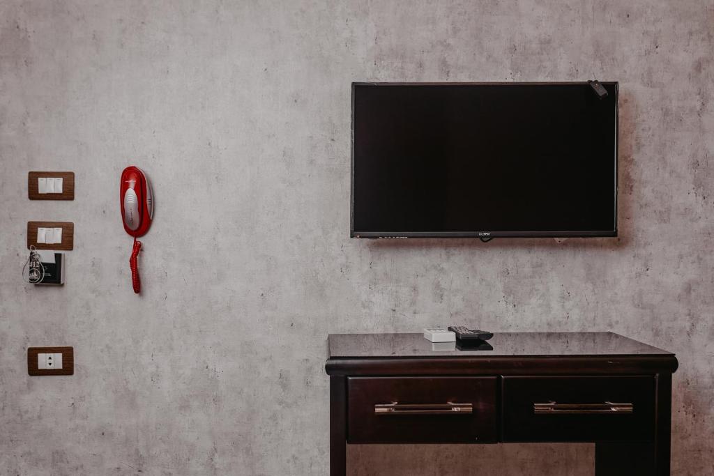 TV a/nebo společenská místnost v ubytování Pyramids Planet Hotel
