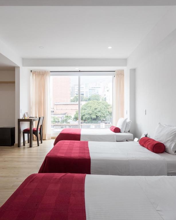 Postel nebo postele na pokoji v ubytování Hotel Florencia Plaza