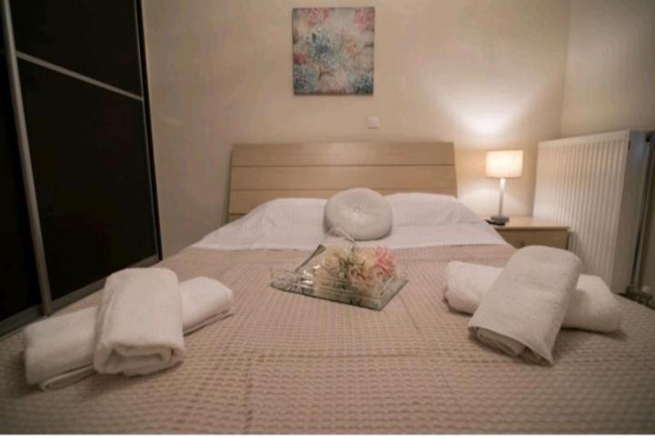 Postel nebo postele na pokoji v ubytování AMMOS