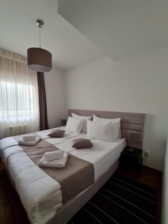 Postel nebo postele na pokoji v ubytování Apartman Ibarstar
