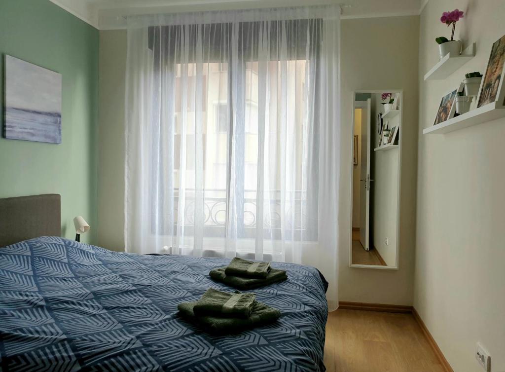 Postel nebo postele na pokoji v ubytování PRONTO apartman & PRONTO studios