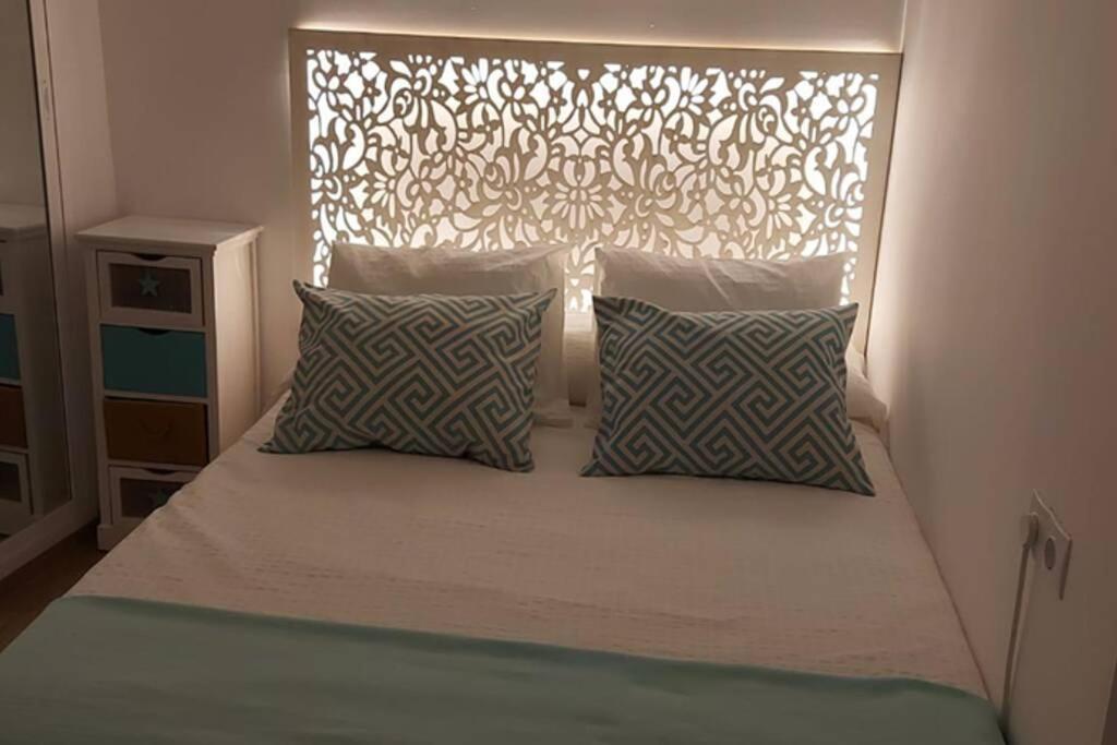 Posteľ alebo postele v izbe v ubytovaní Precioso apartamento 1ª linea de playa Getares