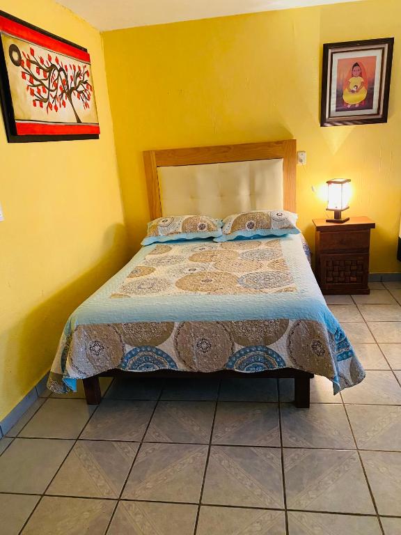 Letto o letti in una camera di El paraíso de Zacatlán DEPARTAMENTO con JARDÍN, 11 pax