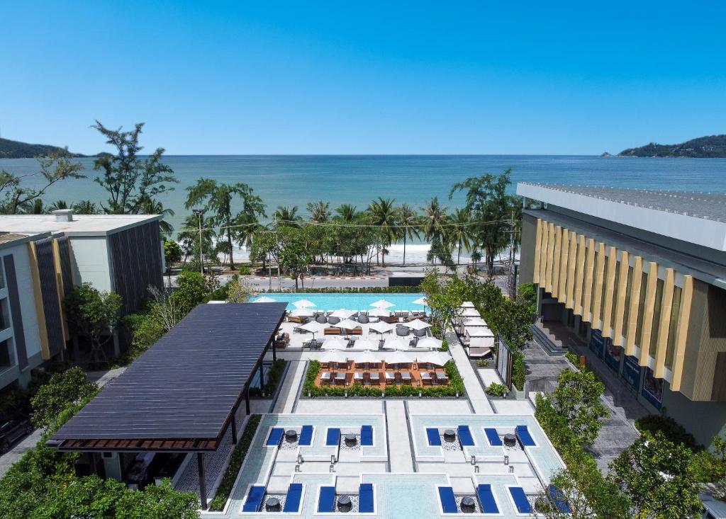 an aerial view of a resort with a pool and the ocean at Four Points by Sheraton Phuket Patong Beach Resort in Patong Beach