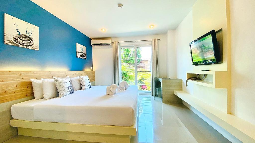 TV a/nebo společenská místnost v ubytování The Palms Residence - SHA Extra Plus