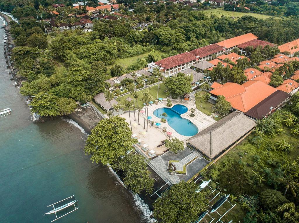 an aerial view of a house next to the water at New Sunari Lovina Beach Resort in Lovina