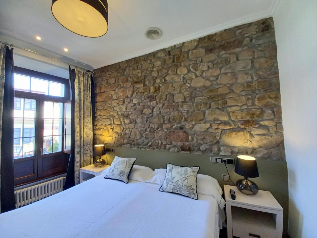 Tempat tidur dalam kamar di Hotel Eutimio
