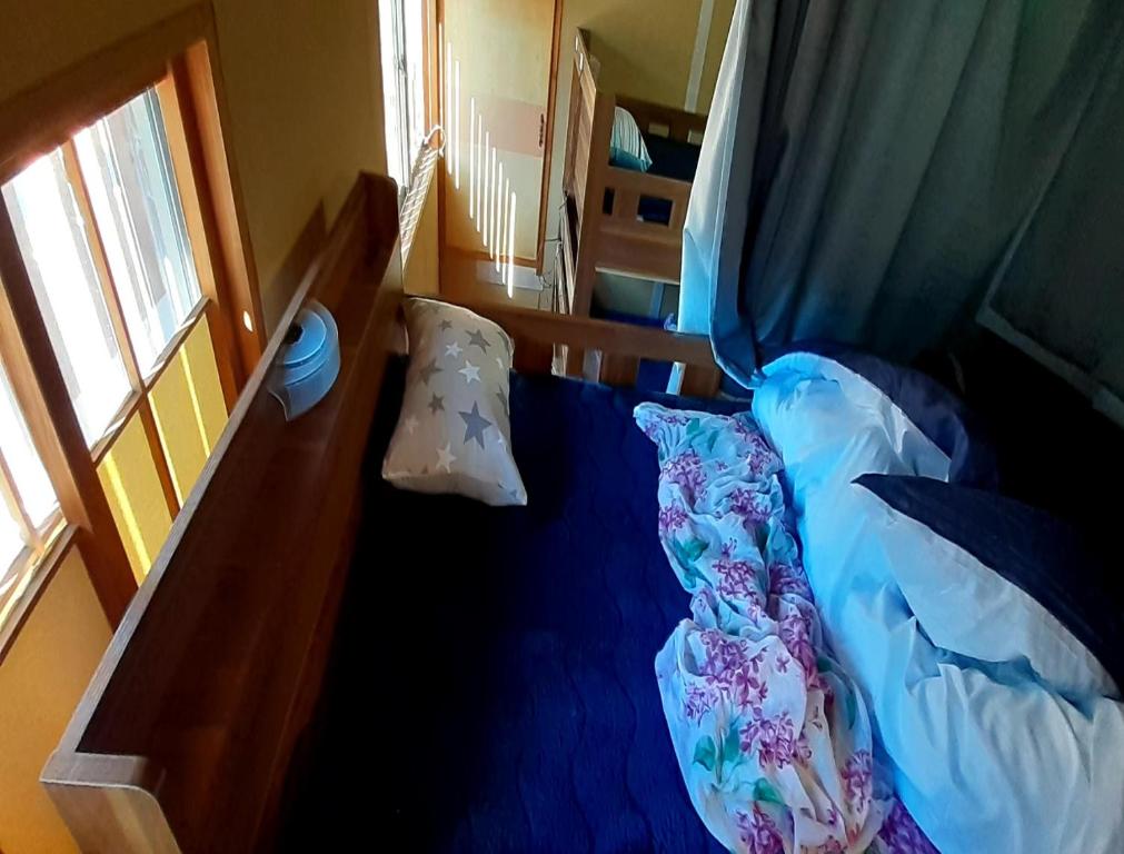Postel nebo postele na pokoji v ubytování TOMI in Shimoda